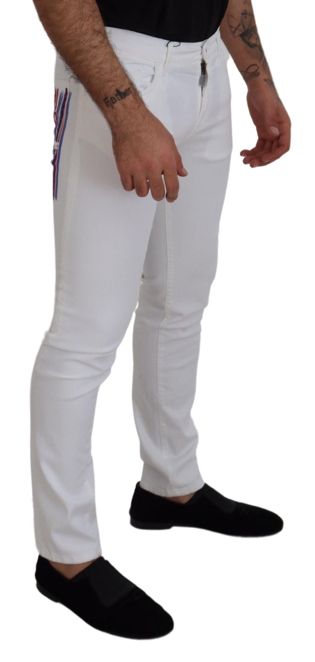 Man wearing white pants and black shoes