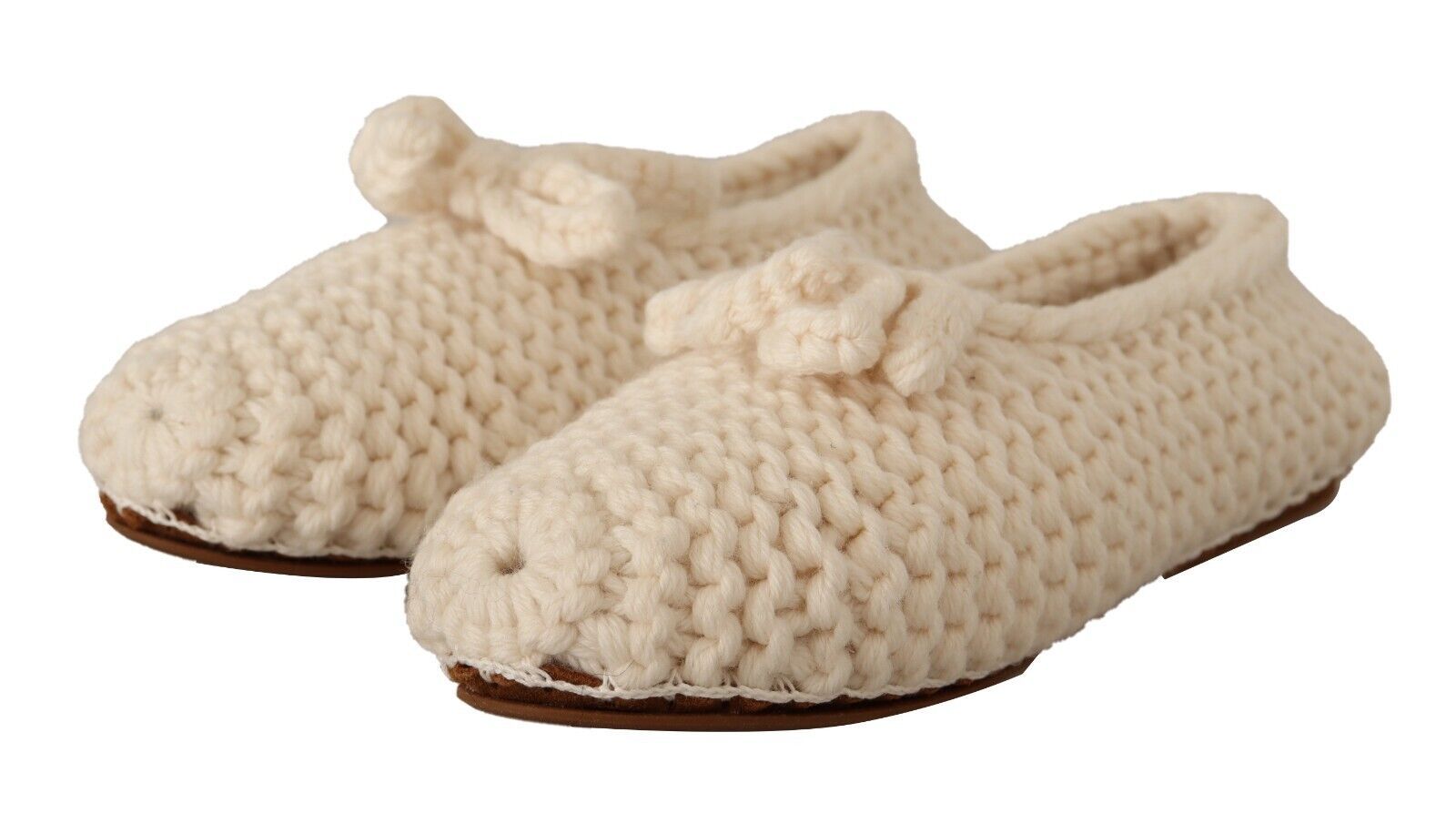 Pair of crocheted baby shoes with bow ties