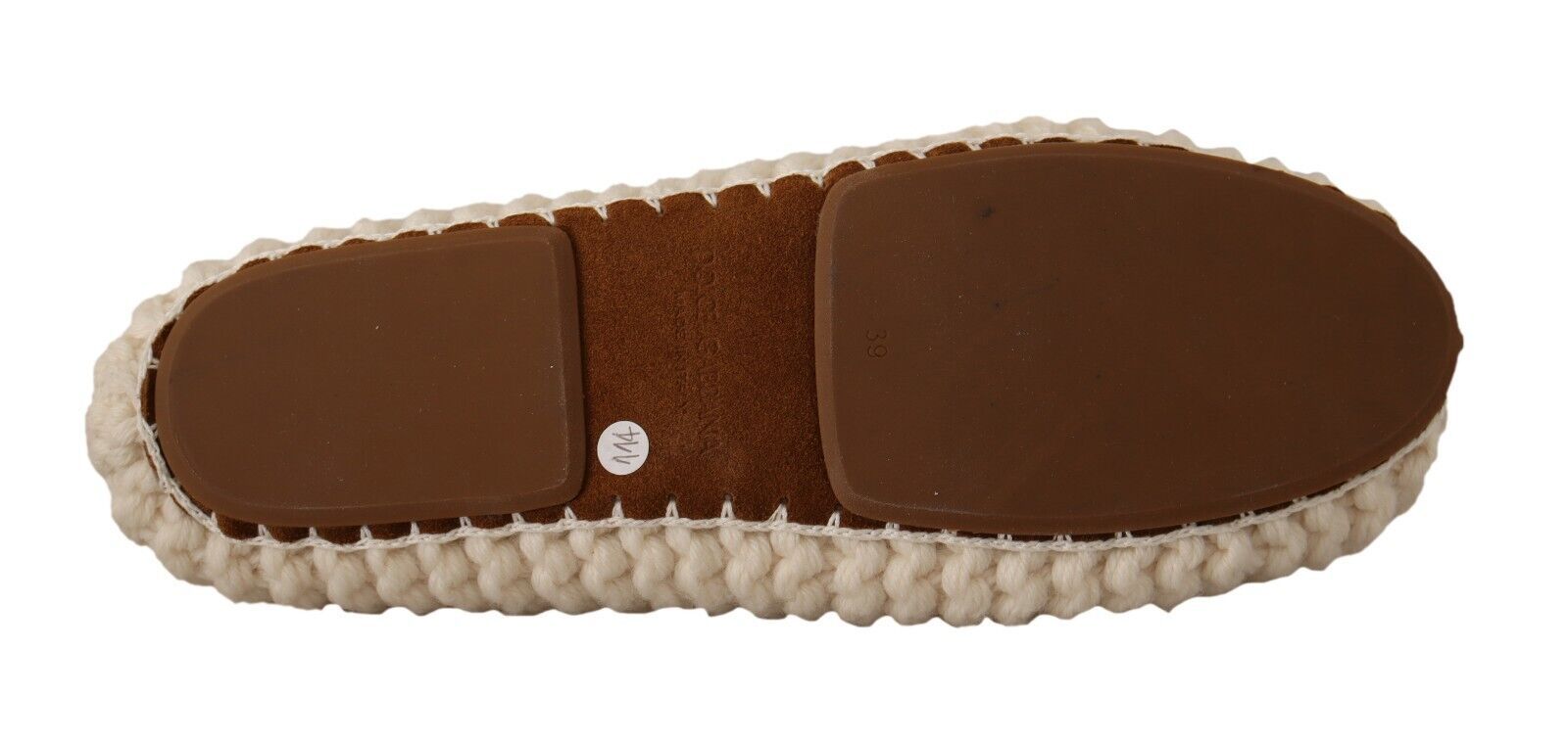 Pair of brown slippers with white trim and a single white button