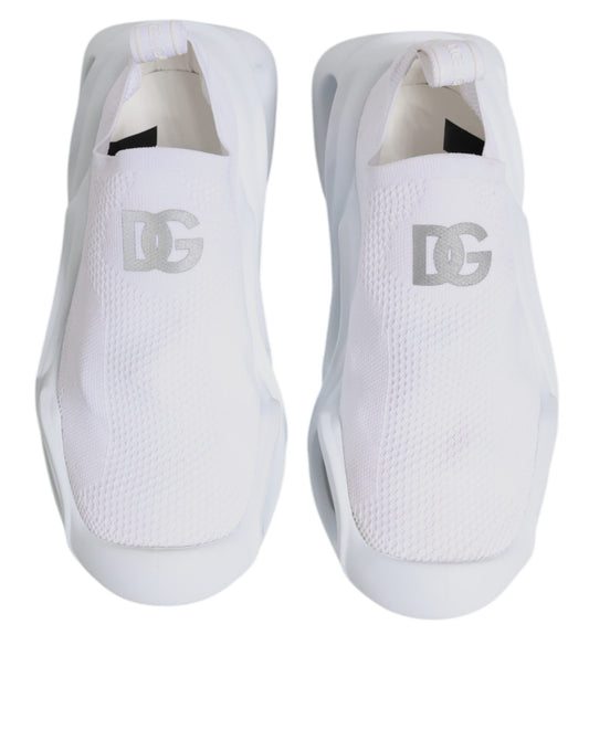 Pair of white sneakers with black logo on side
