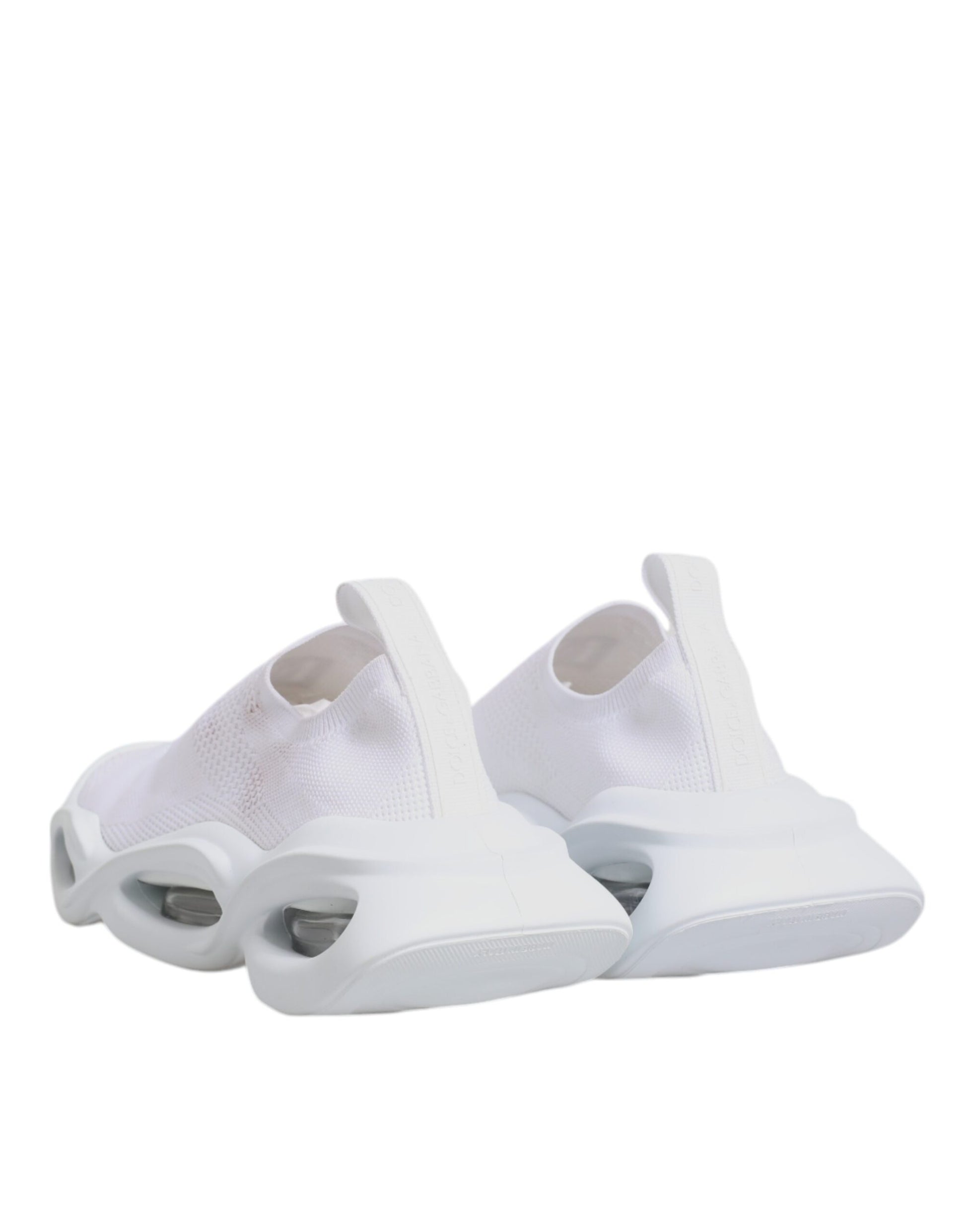 Pair of white sneakers with black soles