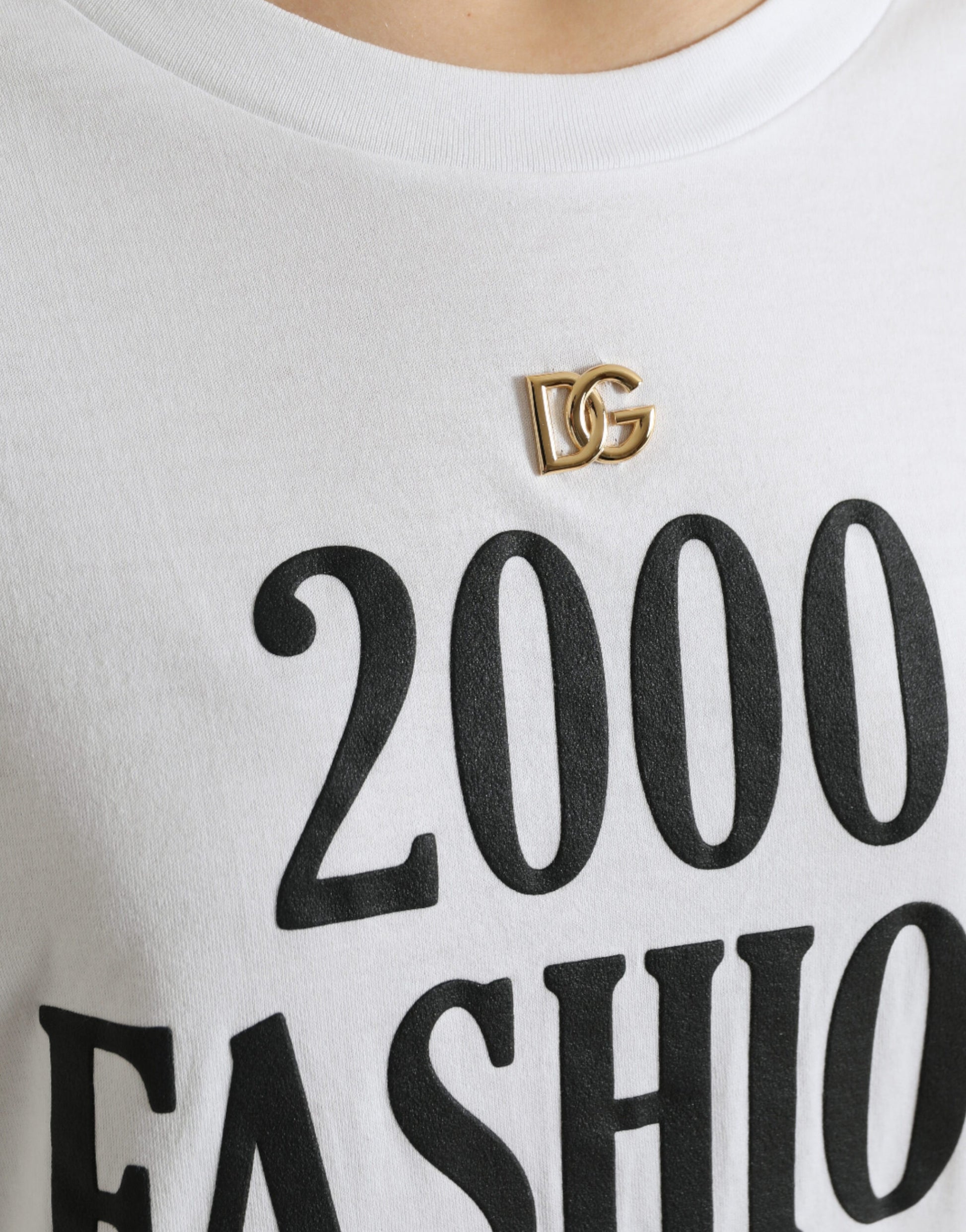 White t-shirt with "2000 fashion" written in black letters