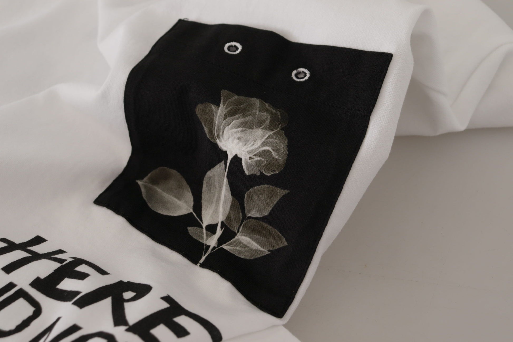 Black floral design on white fabric