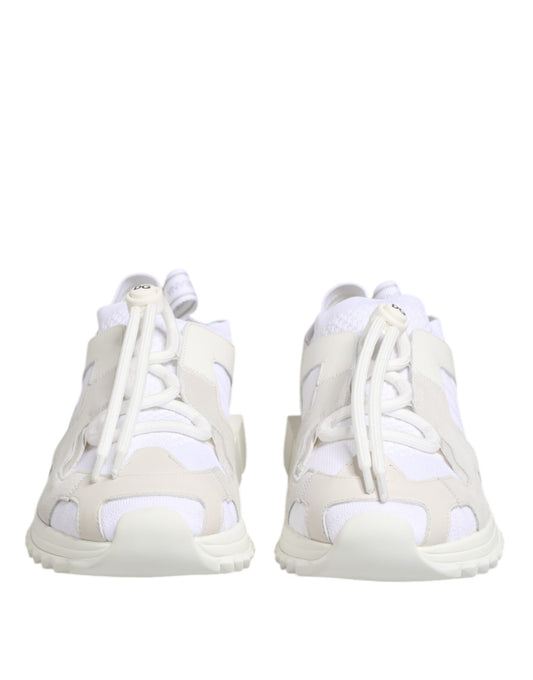 Pair of white lace-up sneakers with a low top and a patterned design