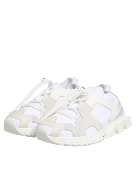 A pair of white lace-up sneakers with a camouflage pattern