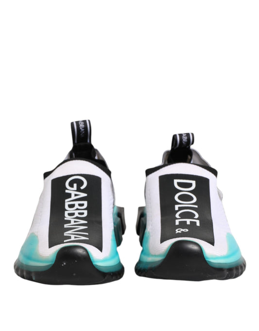 Pair of white slip-on shoes with black and green accents, featuring the Dolce & Gabbana logo