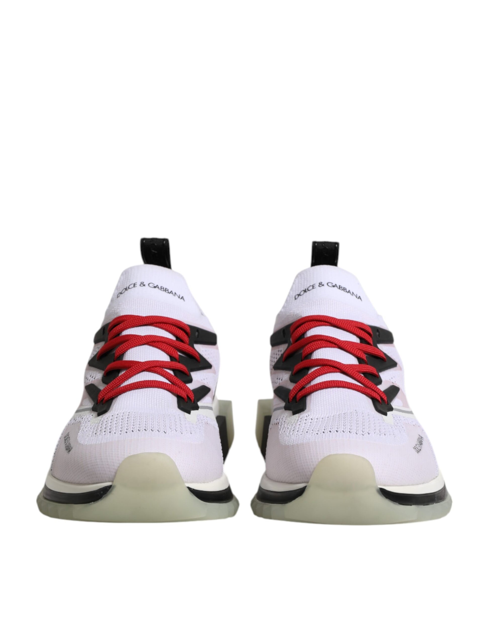 Pair of white sneakers with red laces and black accents, featuring a stretchy knit upper