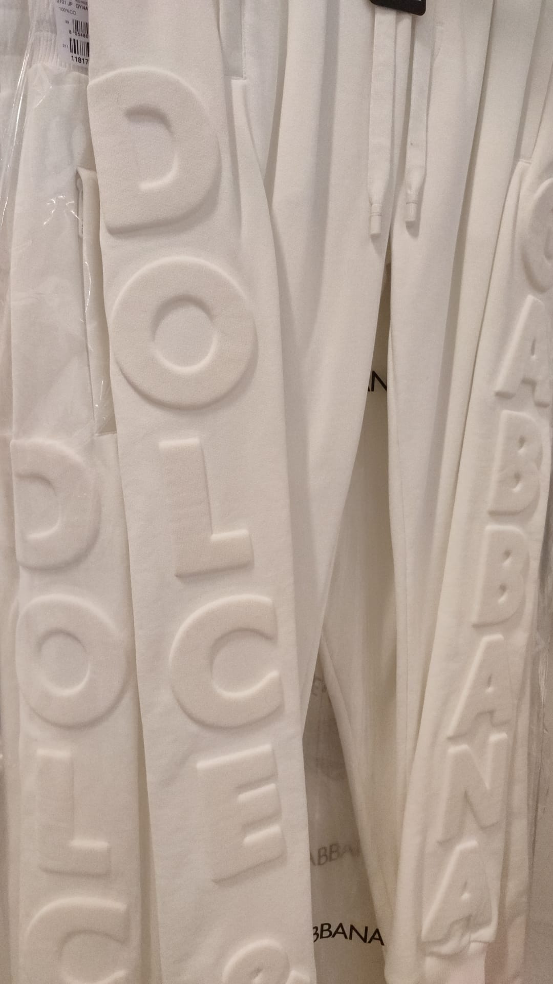 White pants with brand name on waistband