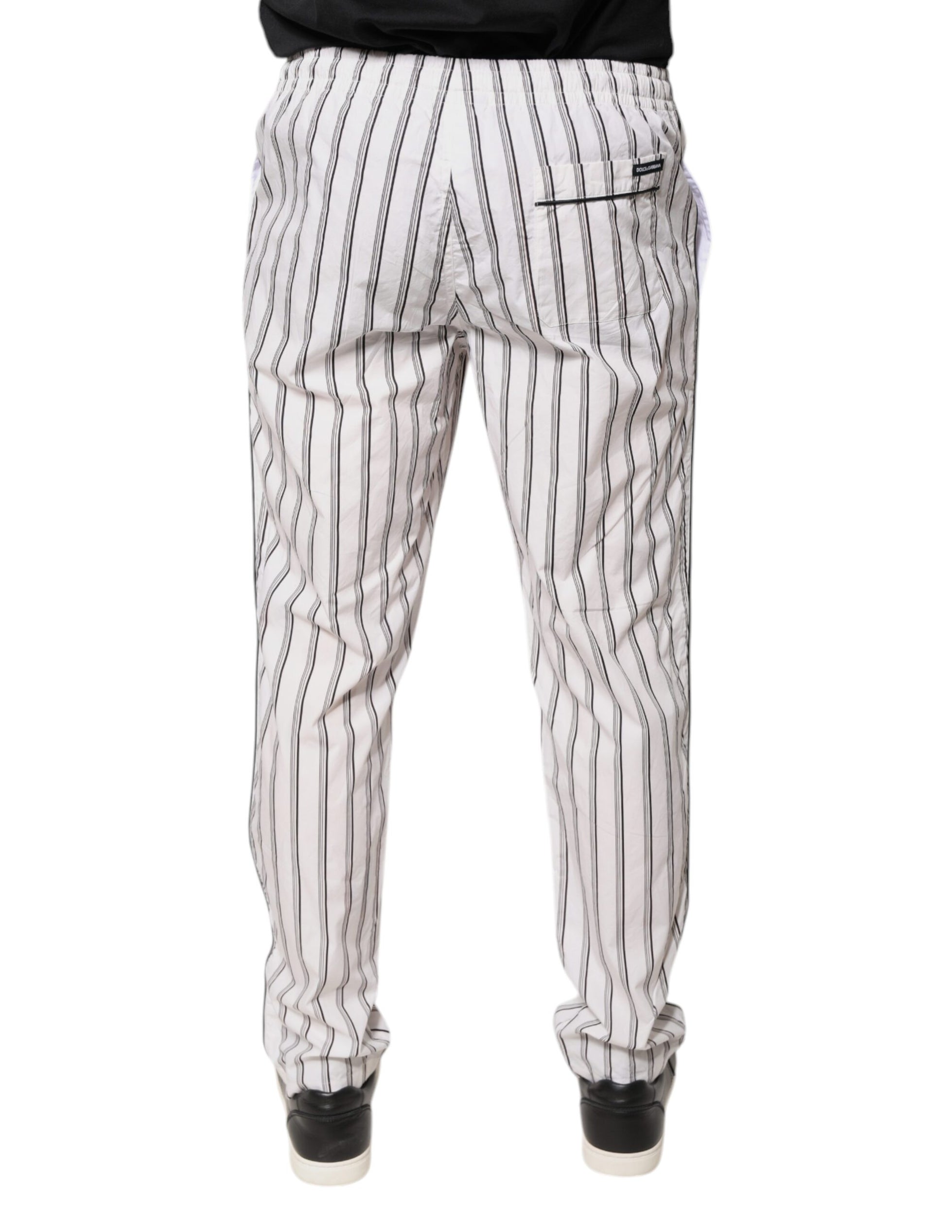 A pair of white striped cotton skinny dress pants from the brand Dolce & Gabbana