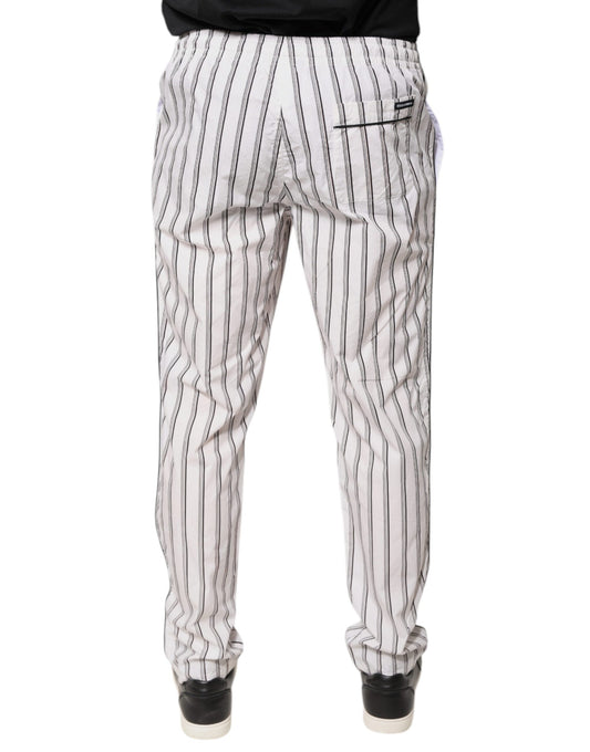 A pair of white striped cotton skinny dress pants from the brand Dolce & Gabbana