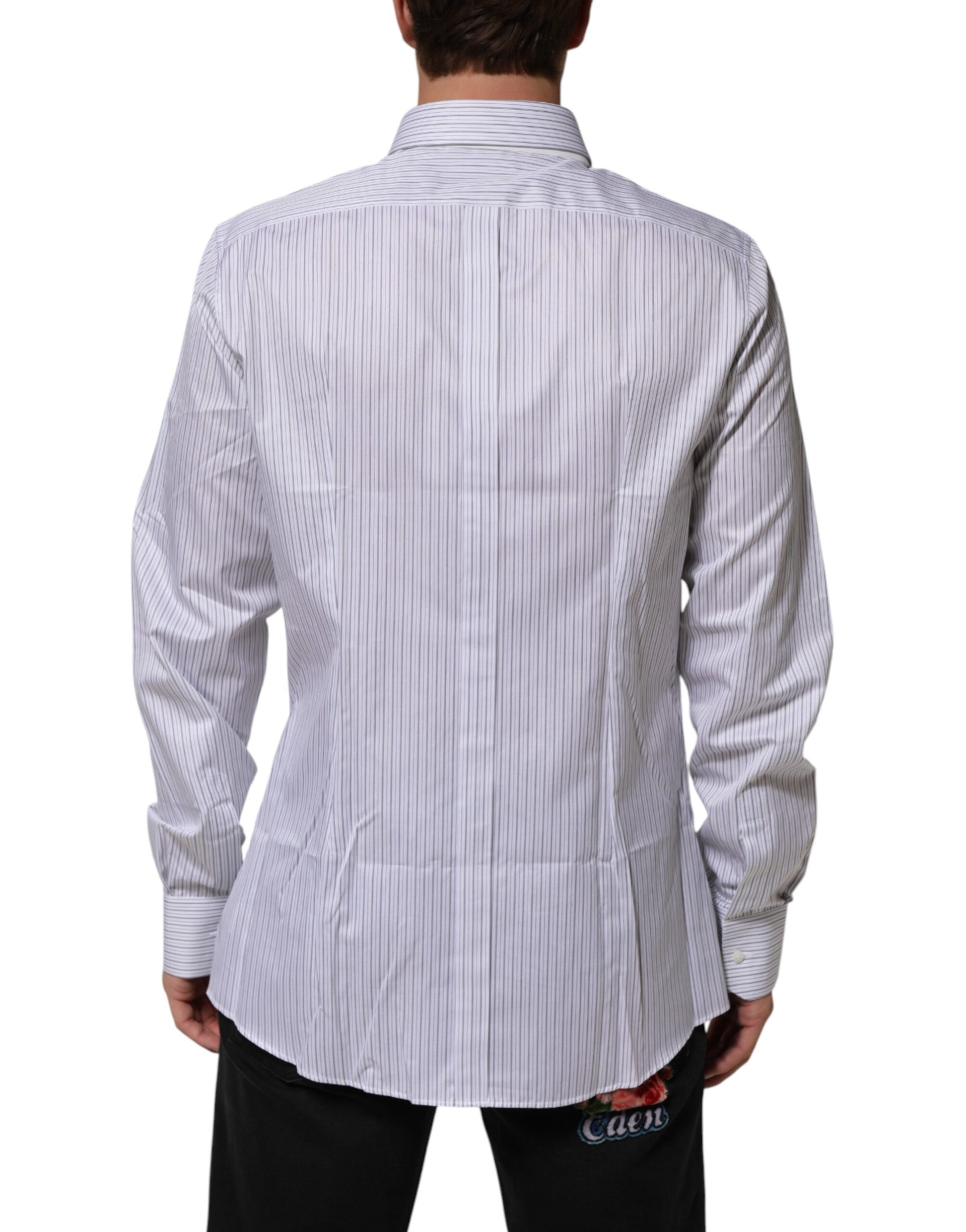 A long sleeve dress shirt with white stripes and a gold design