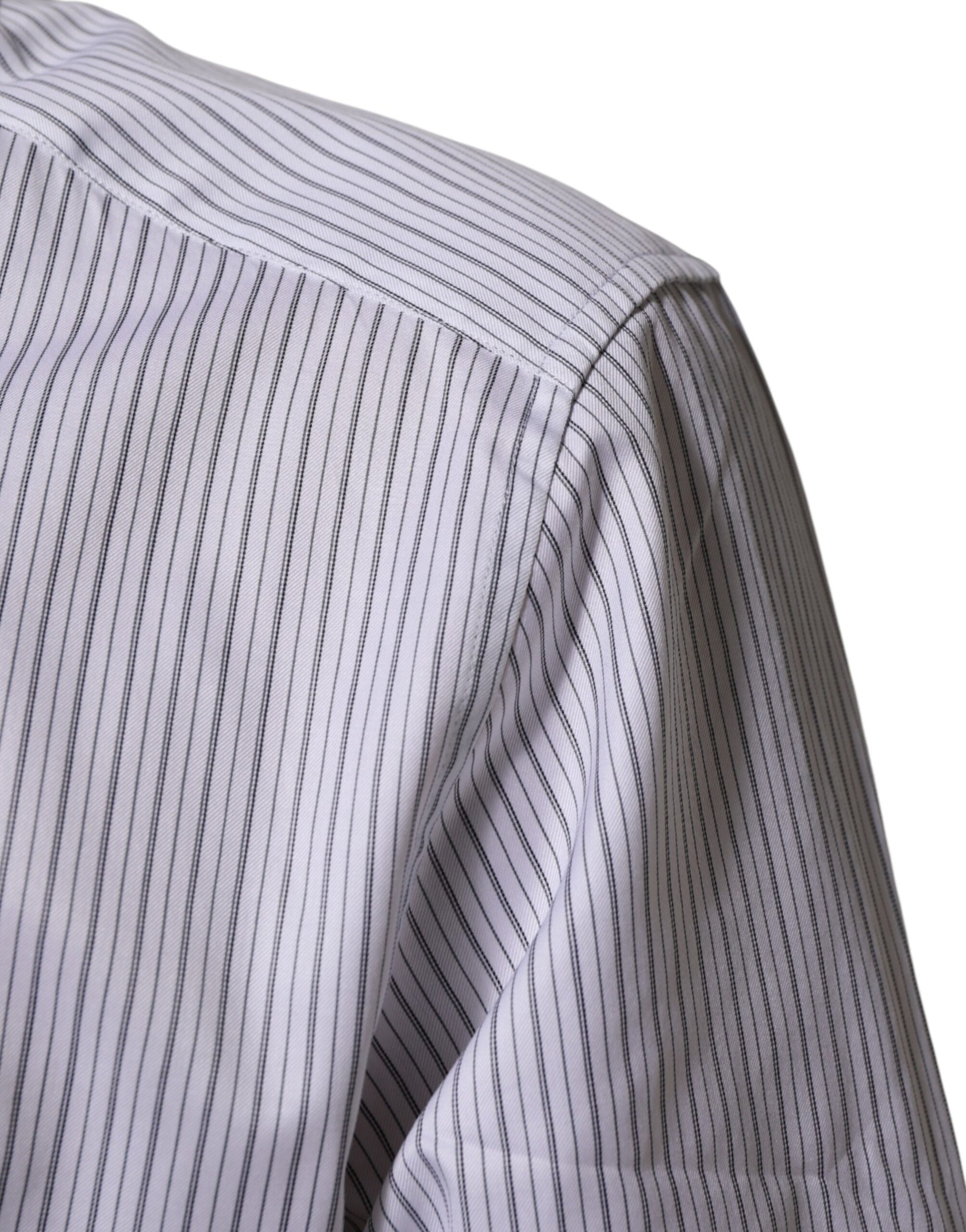 A long sleeve dress shirt with white stripes and gold accents