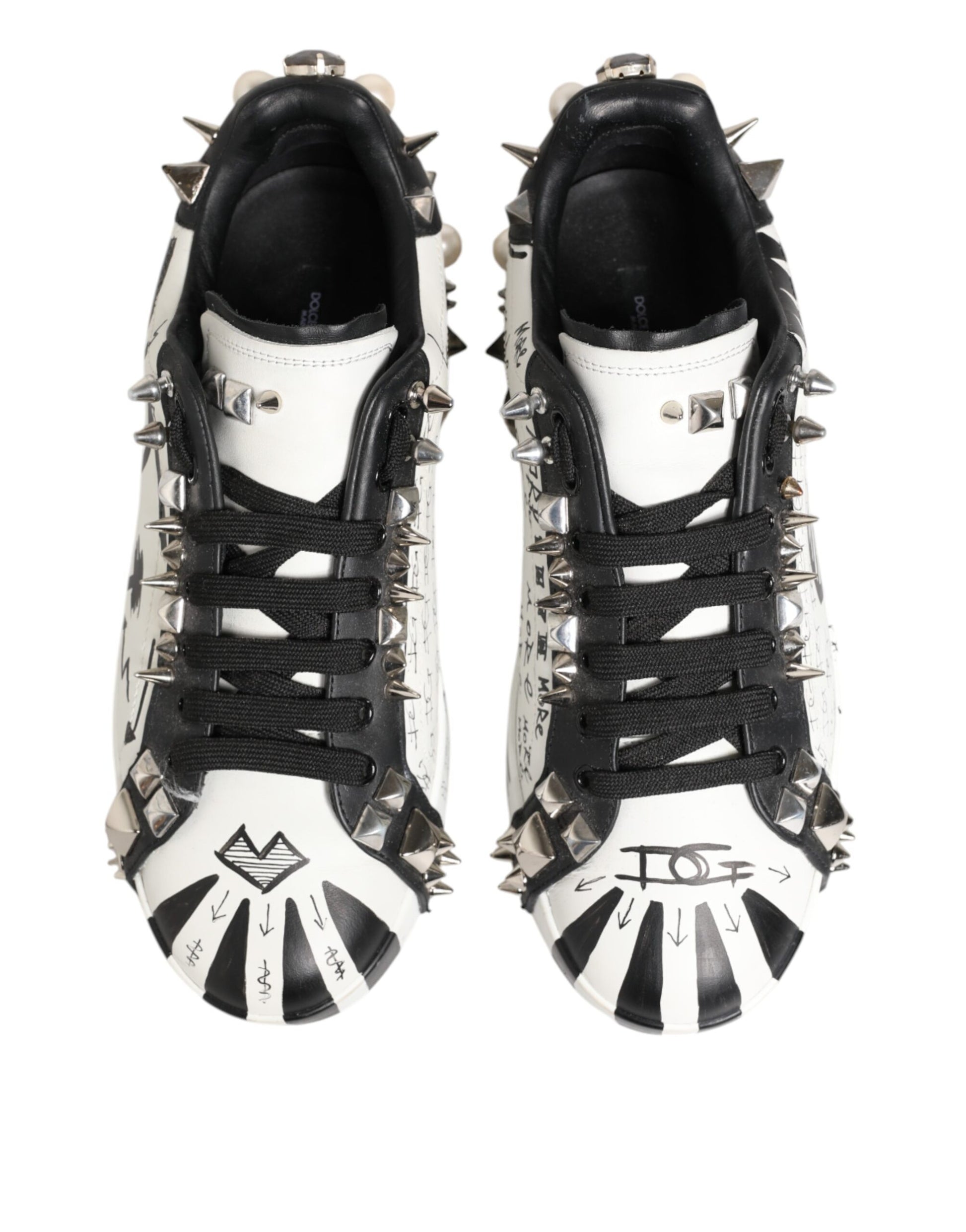 Pair of black and white studded sneakers with printed design
