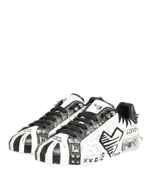 Black and white sneakers with studs, featuring a printed design on the side