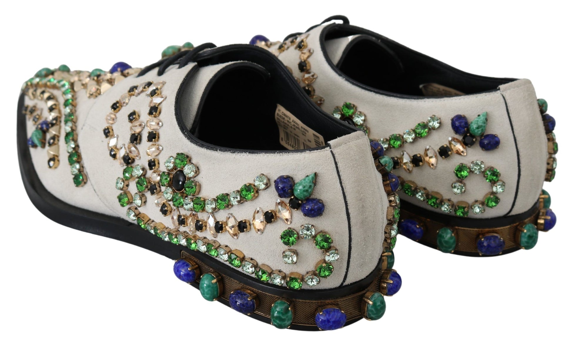 Pair of shoes with embellishments including jewels and stones