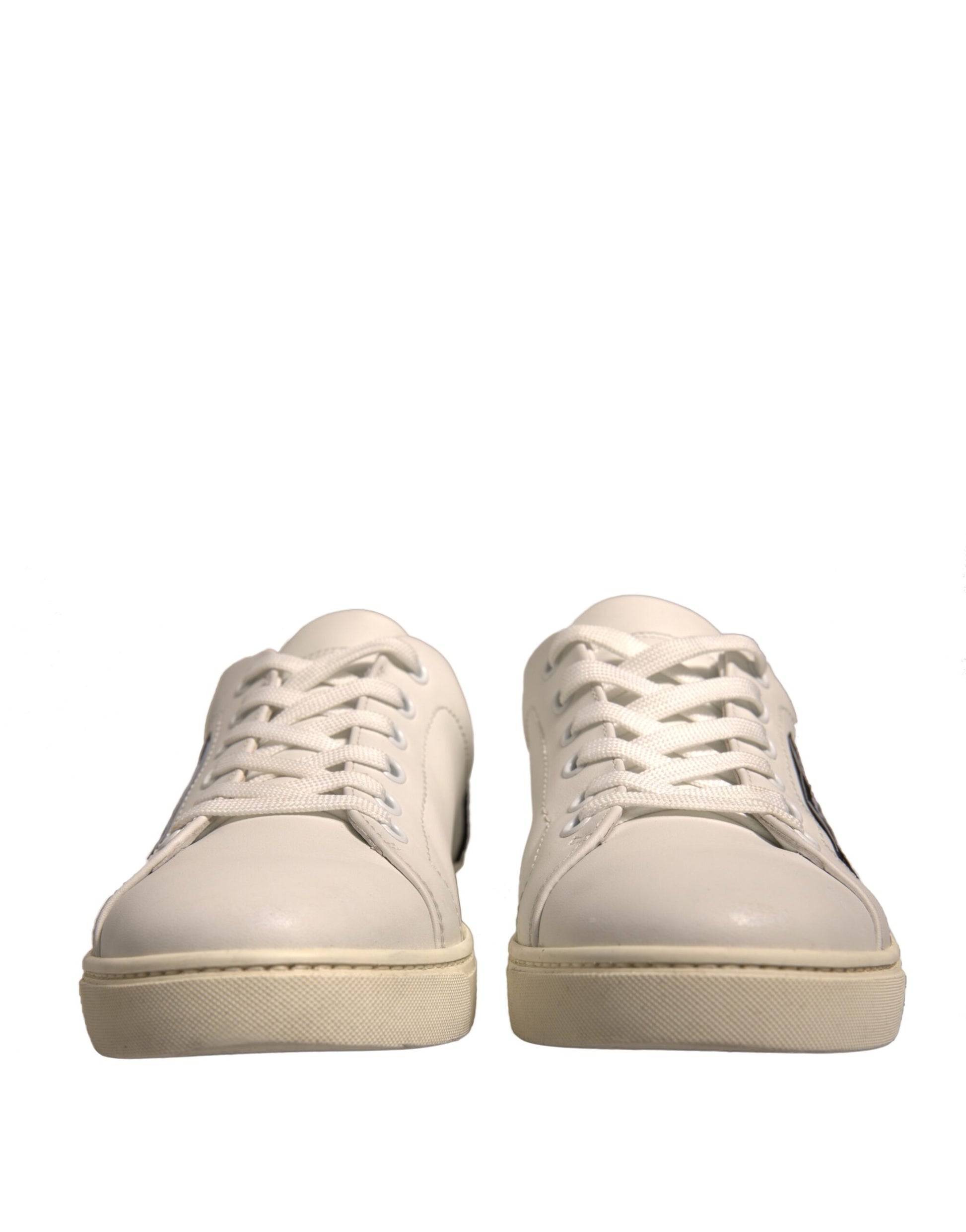 Pair of white sneakers with laces