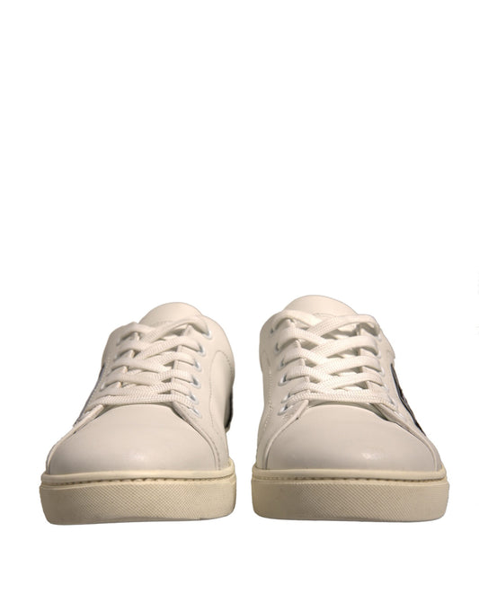 Pair of white sneakers with laces