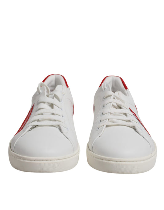 Pair of white sneakers with red accents