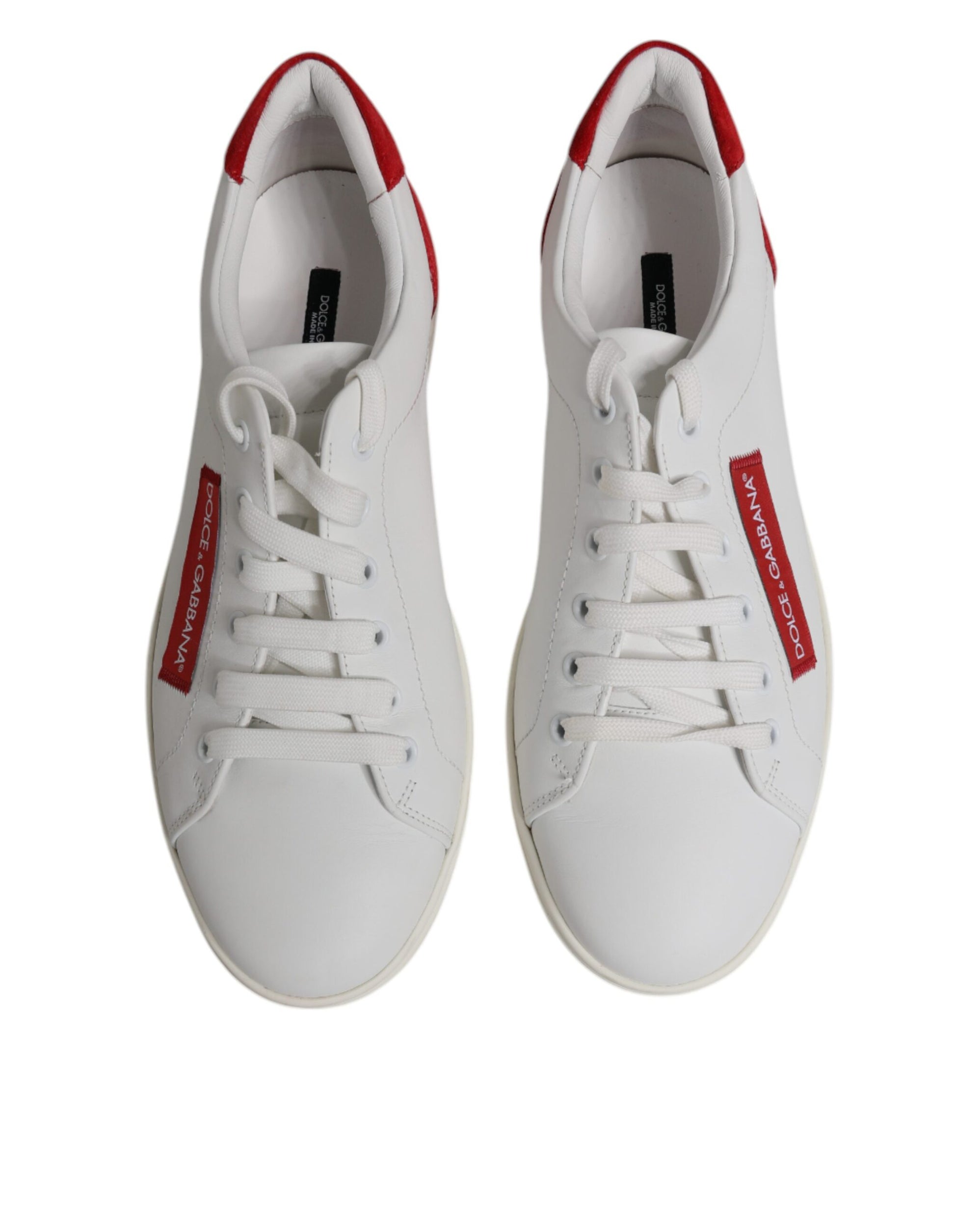 Pair of white sneakers with red accents