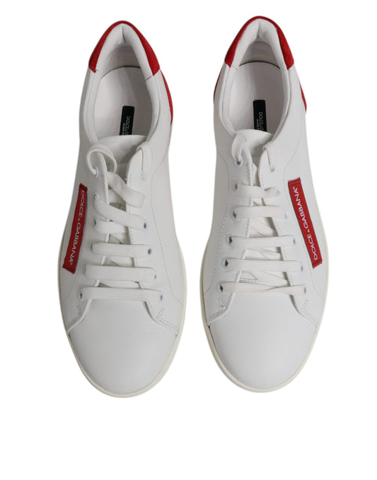 Pair of white sneakers with red accents