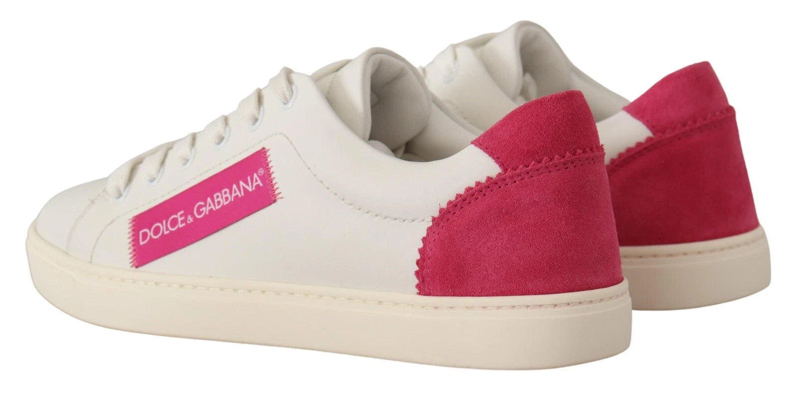 Pair of white suede leather low top sneakers with red accents and pink logo