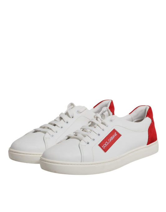 White sneakers with red laces and a logo on the side