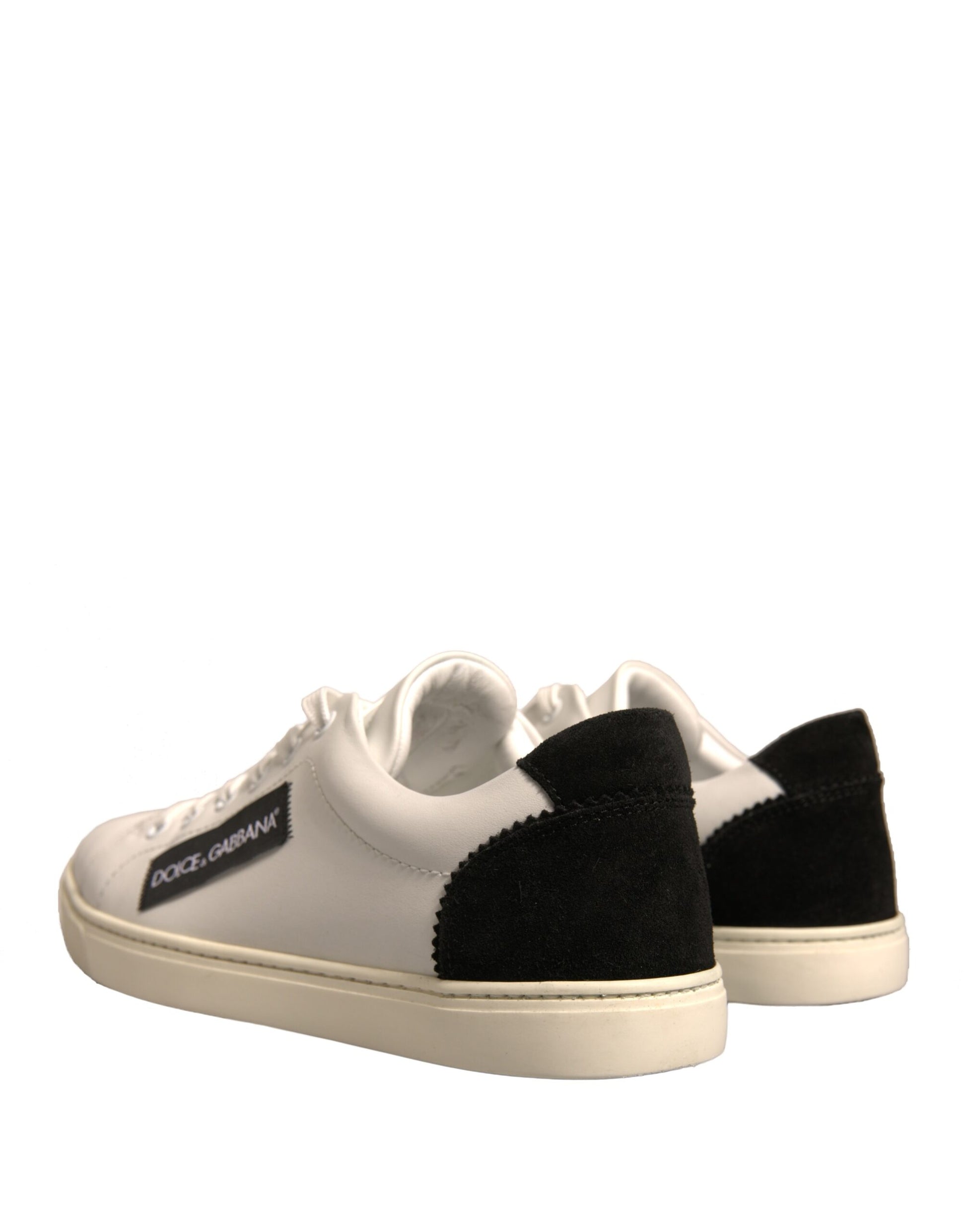 Pair of sneakers with black and white checkered pattern on sides