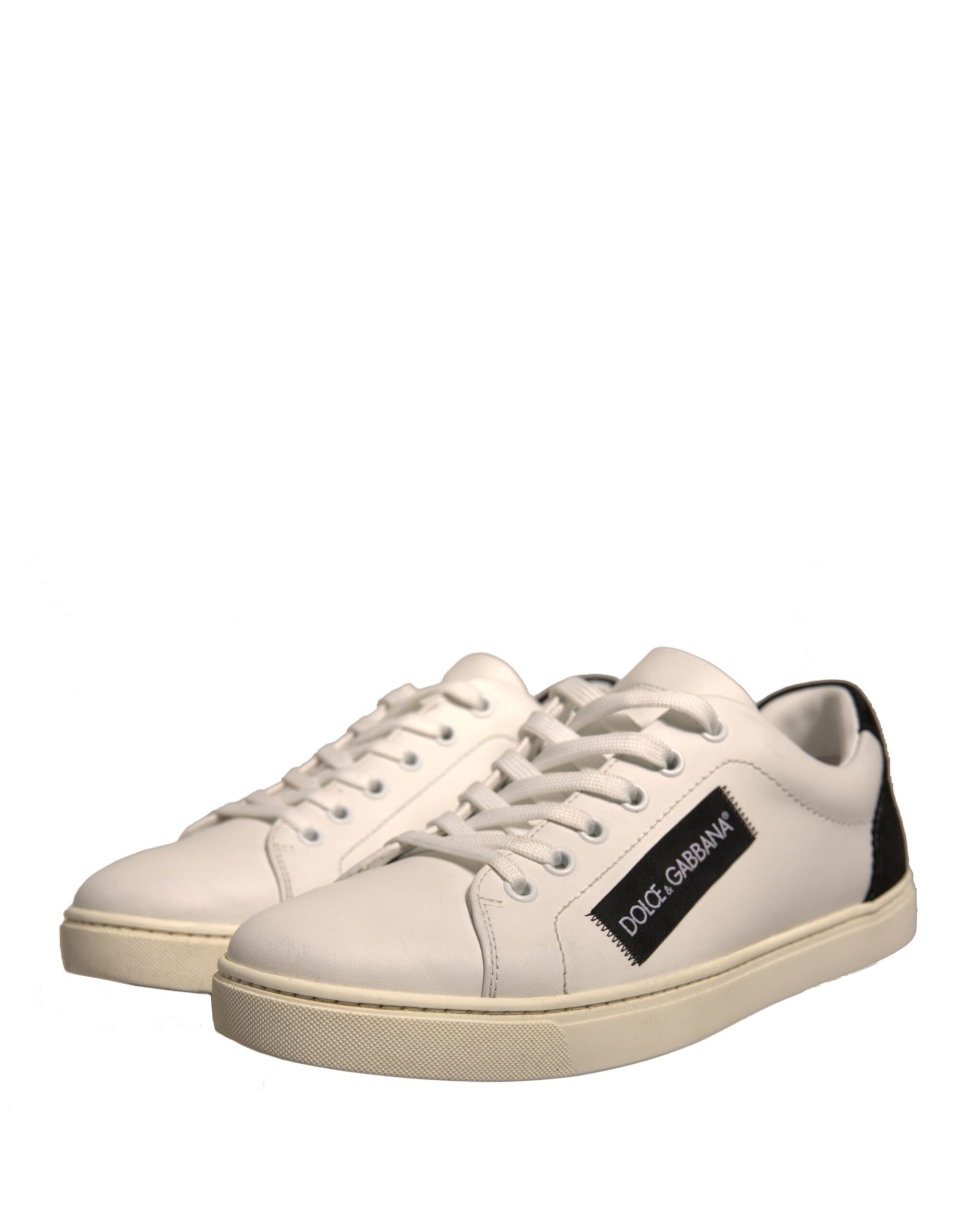 White sneakers with black laces and a small logo on the side