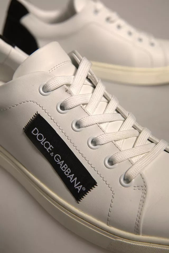 White sneakers with black laces and a label on the side reading "D&G CABANA"
