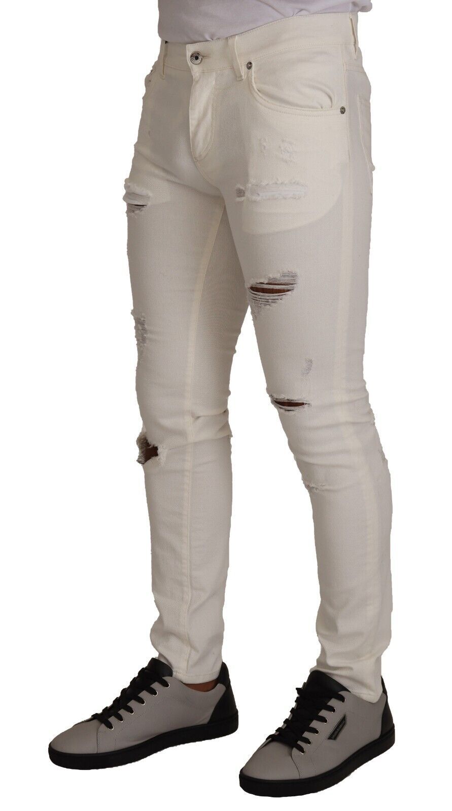 Pair of light wash denim jeans with distressed areas on thighs