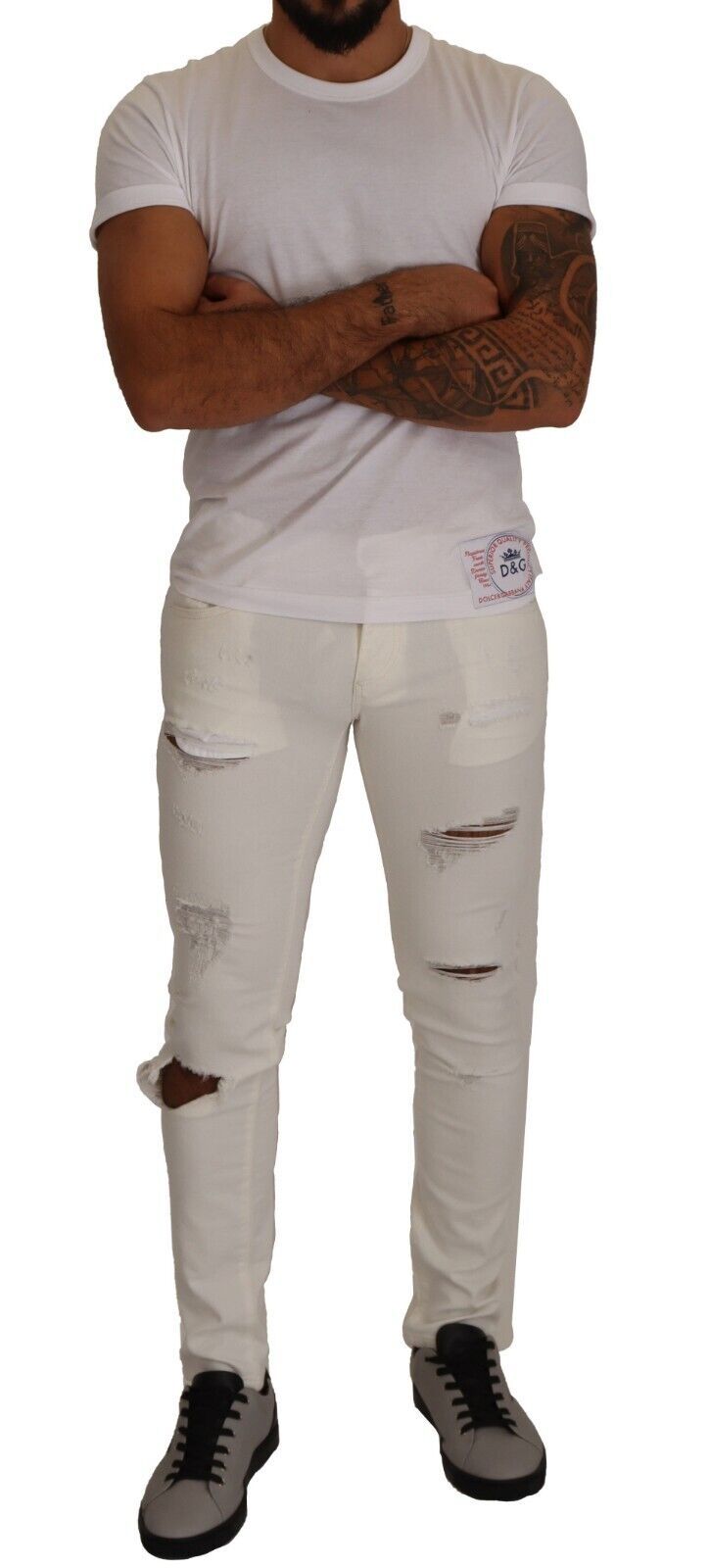 Man wearing white t-shirt and ripped jeans