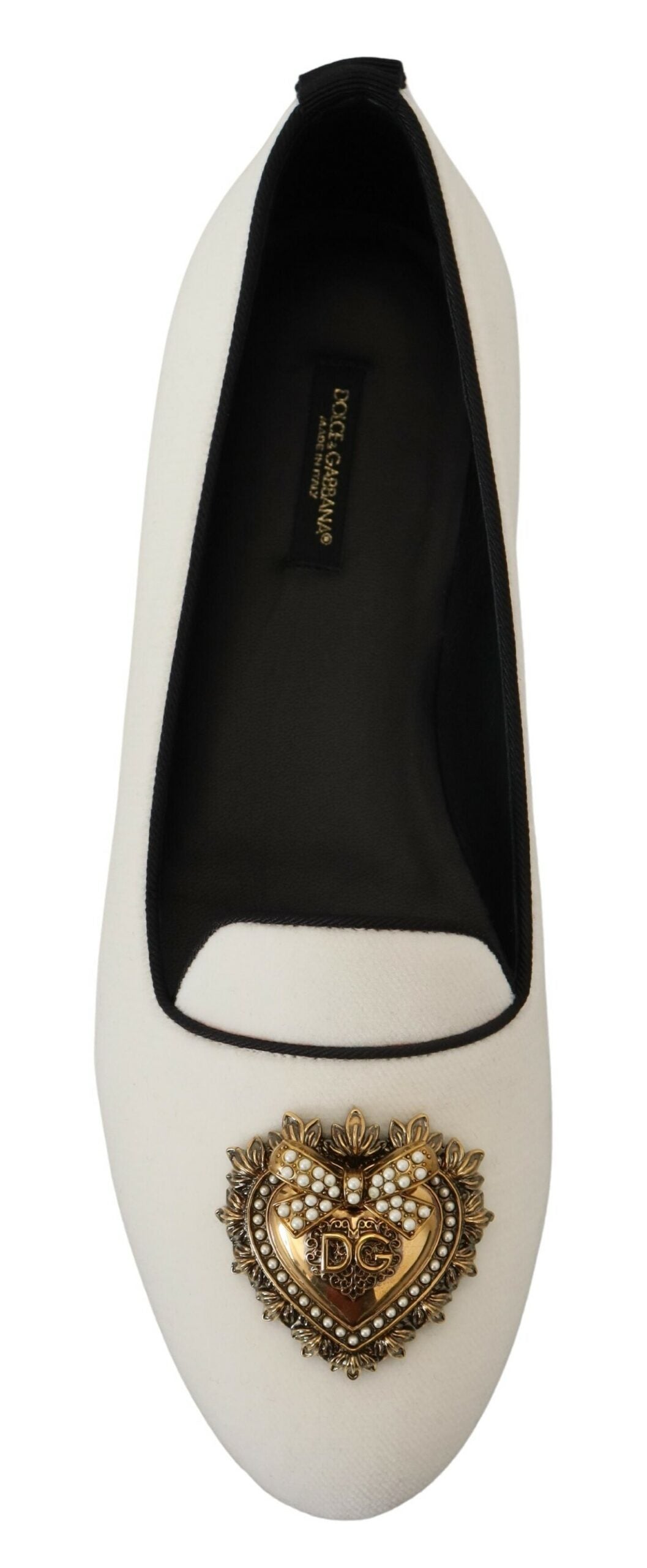 Black and white shoe with a heart embellishment on the toe