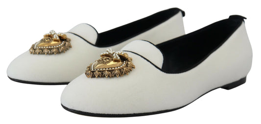 Pair of black and white shoes with gold embellishments