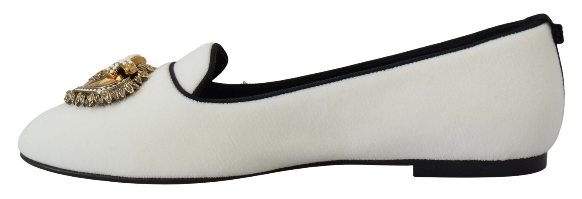 Pair of black and white furry slippers with gold embellishment on top