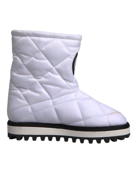 White quilted snow boot with black trim and sole