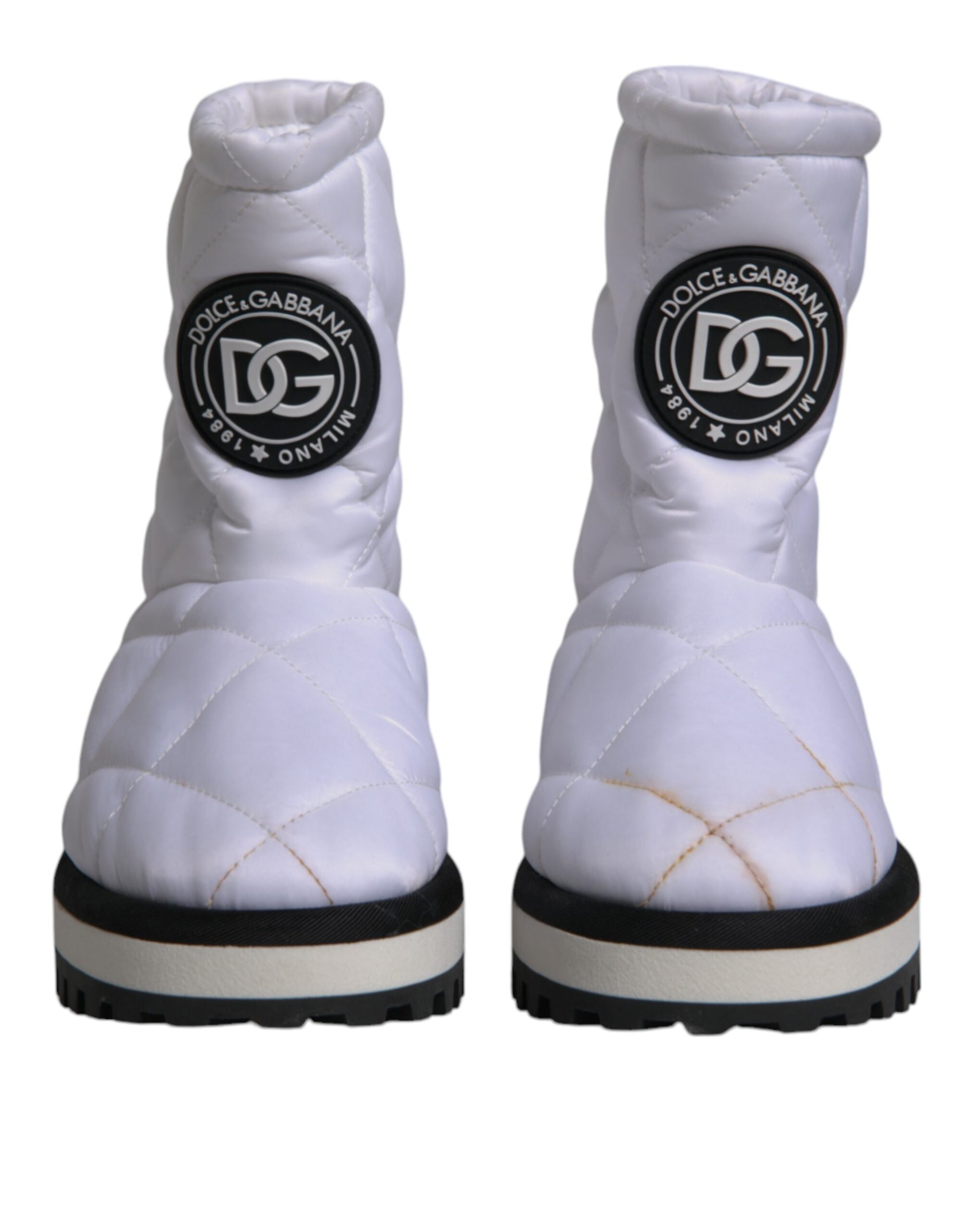 White snow boot with black logo on side