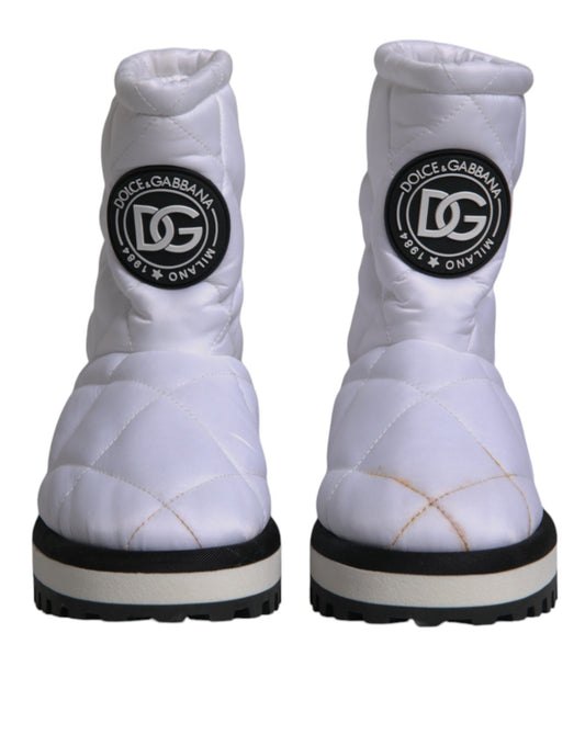 White snow boot with black logo on side