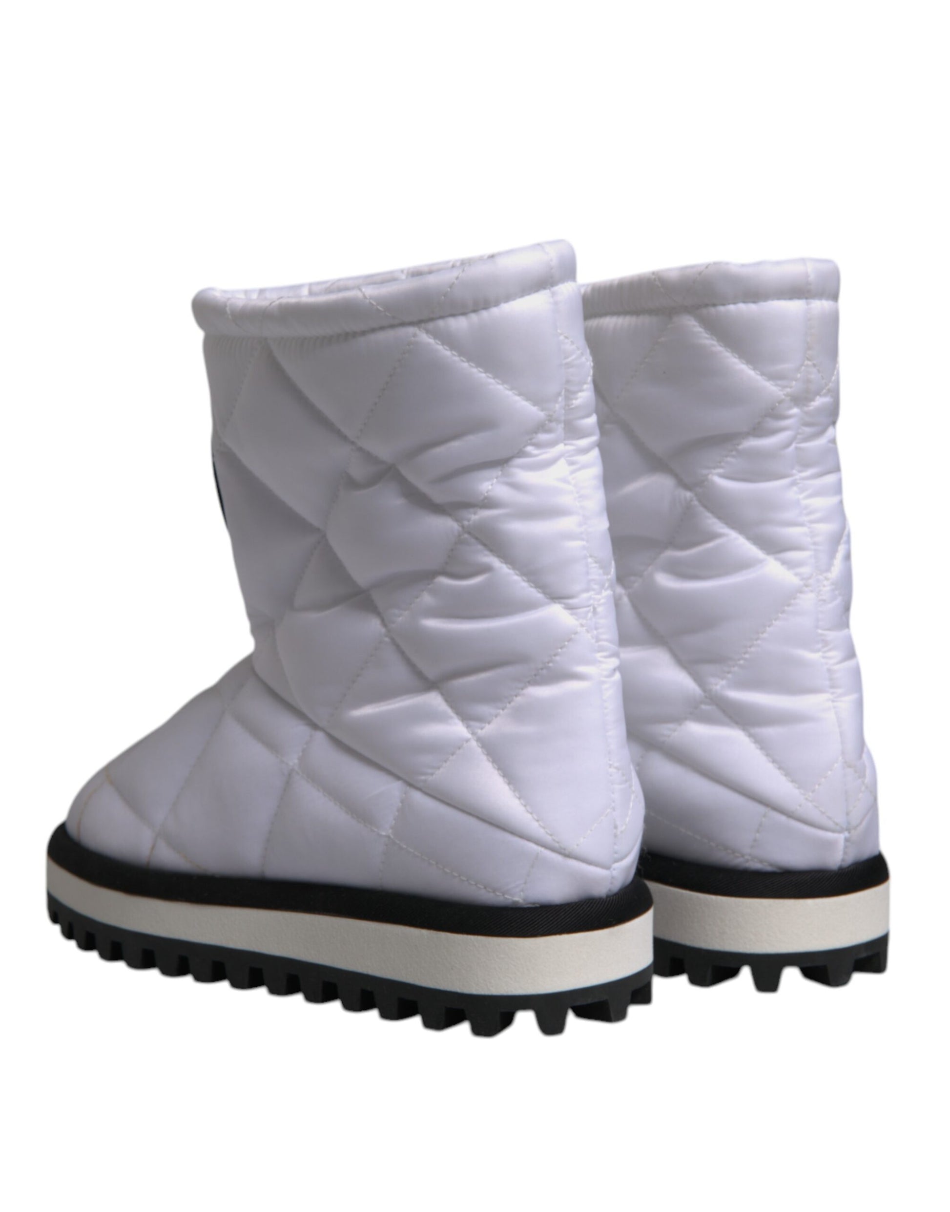 White snow boots with black soles