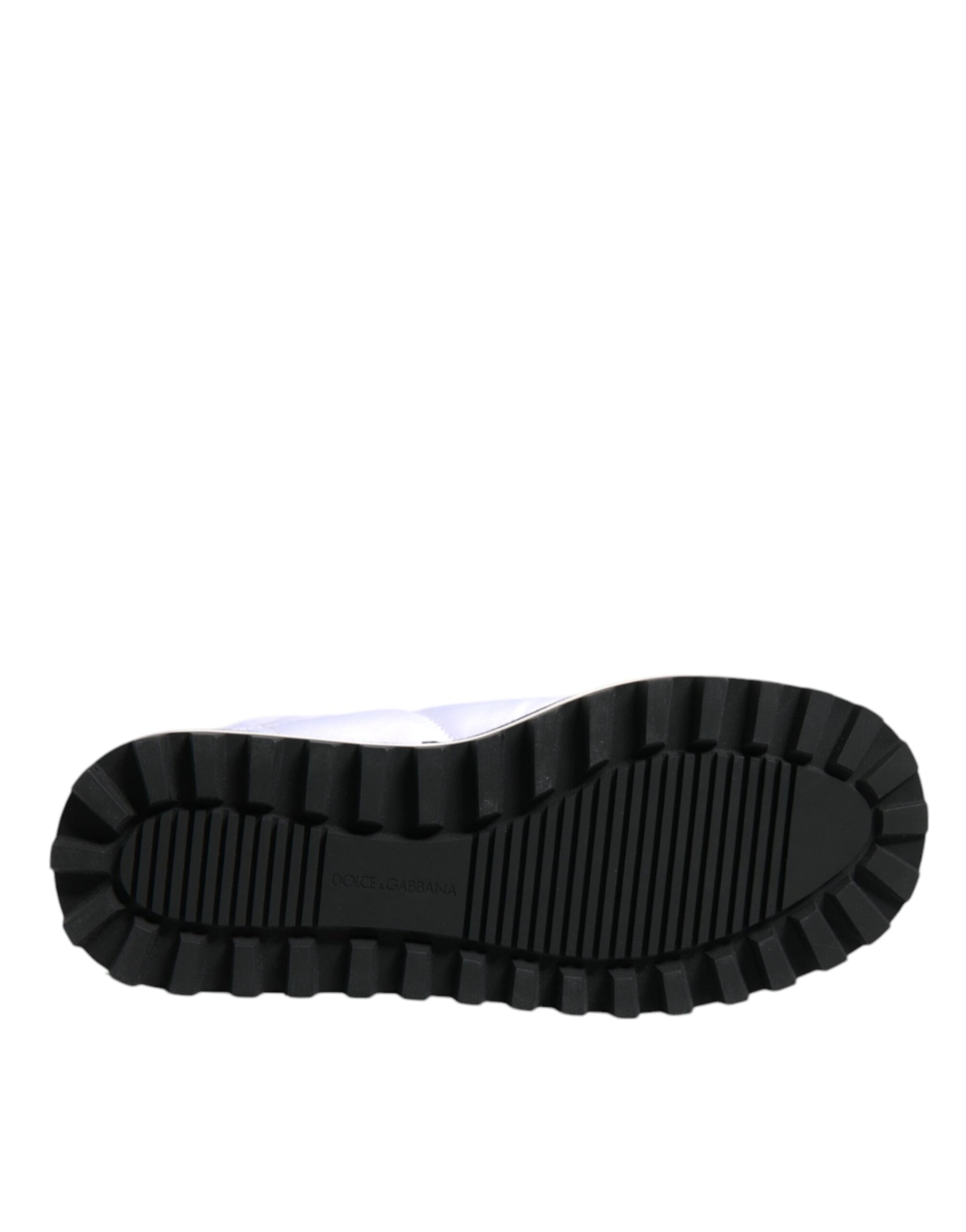 Black rubber boot with deep treads for outdoor use