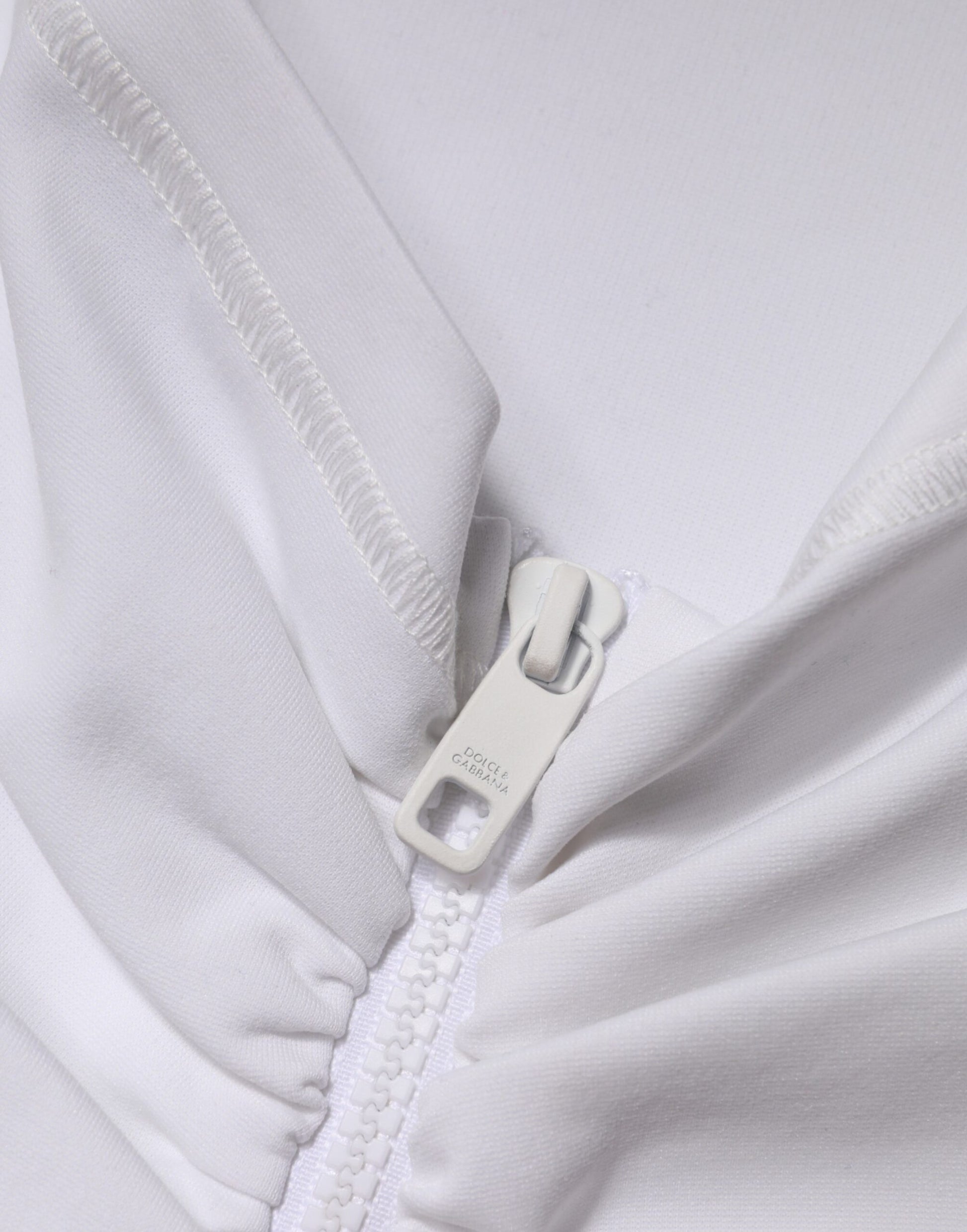 White garment with zipper closure