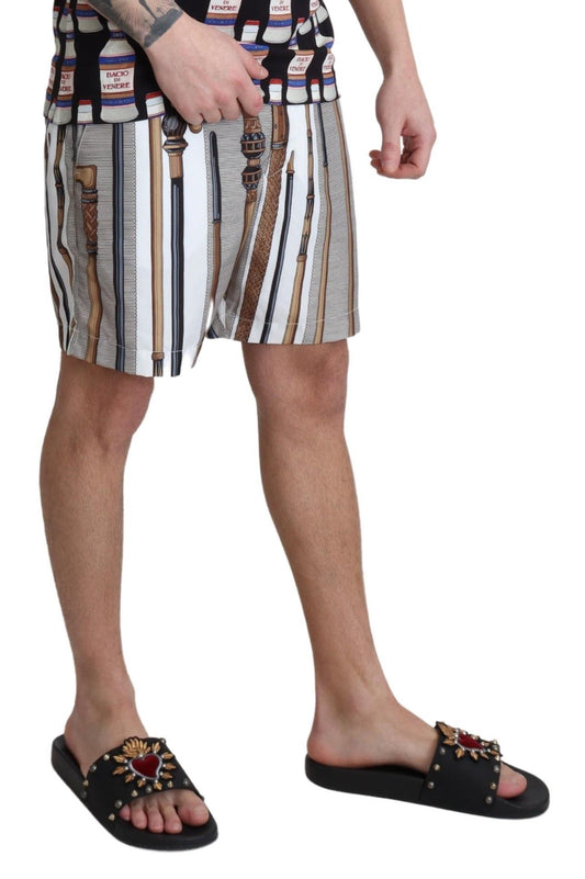 Man wearing patterned shorts and sandals