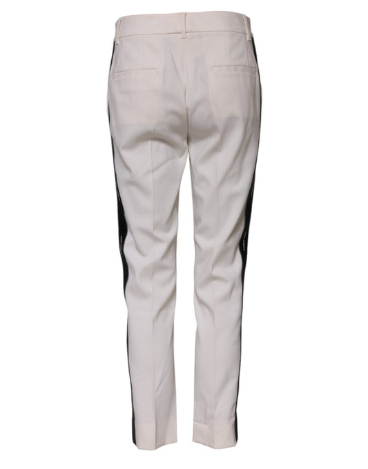 Pair of light beige pants with black stripe down side