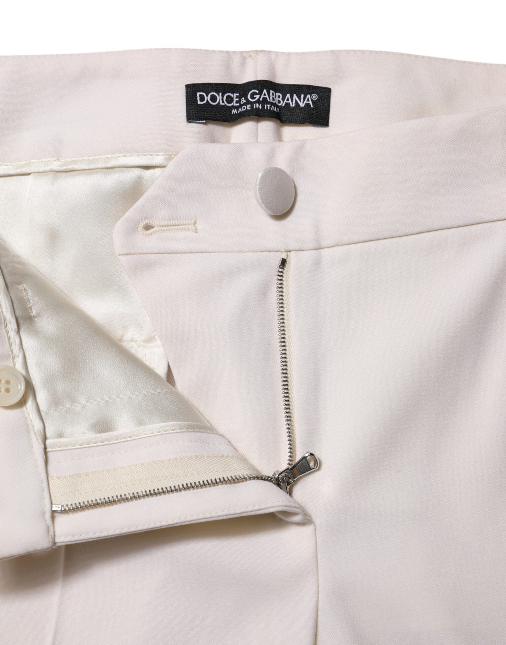 Pair of light pink trousers with zippered pockets