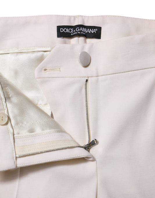 Pair of light pink trousers with zippered pockets