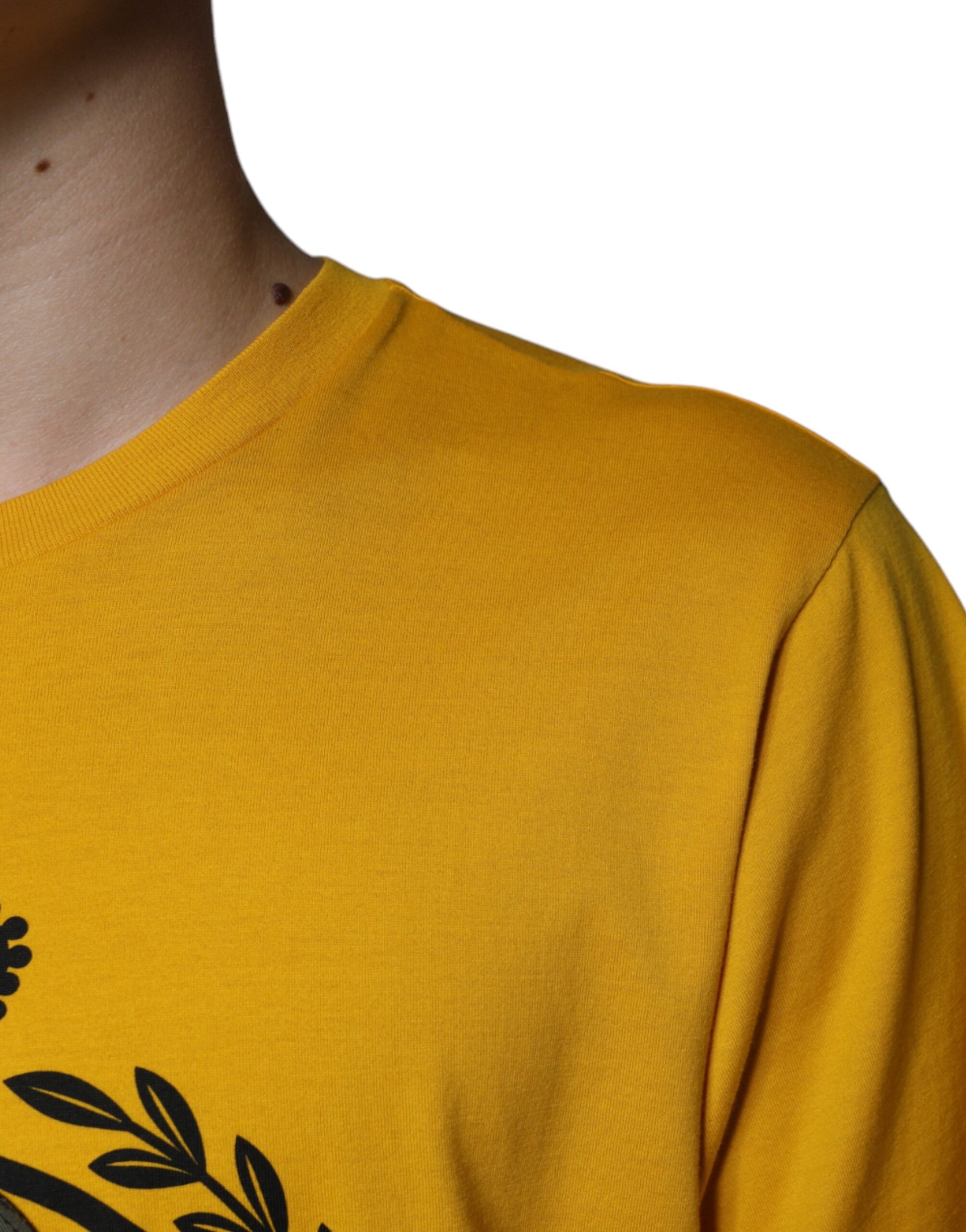 Yellow long sleeve shirt on person's shoulder