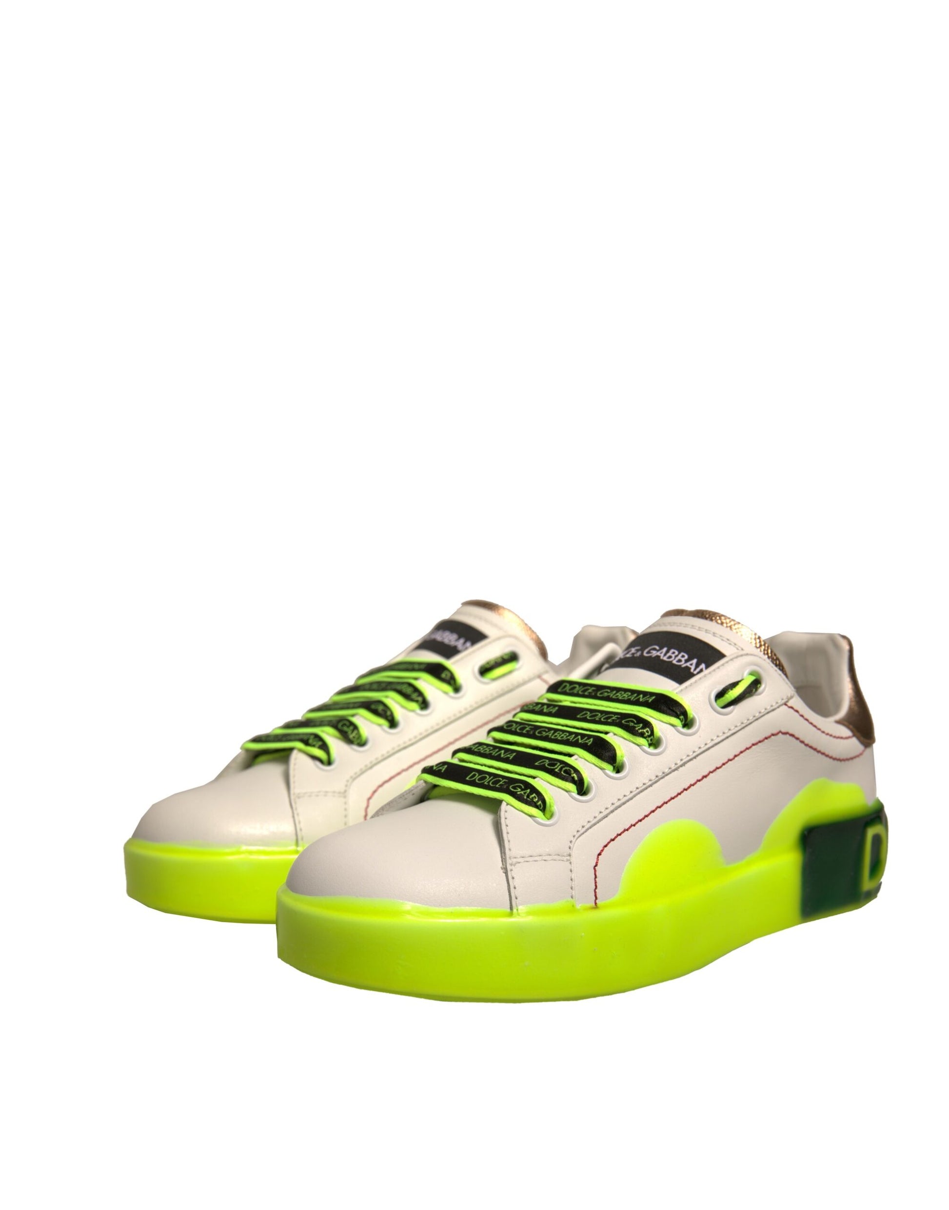 Pair of white sneakers with green laces