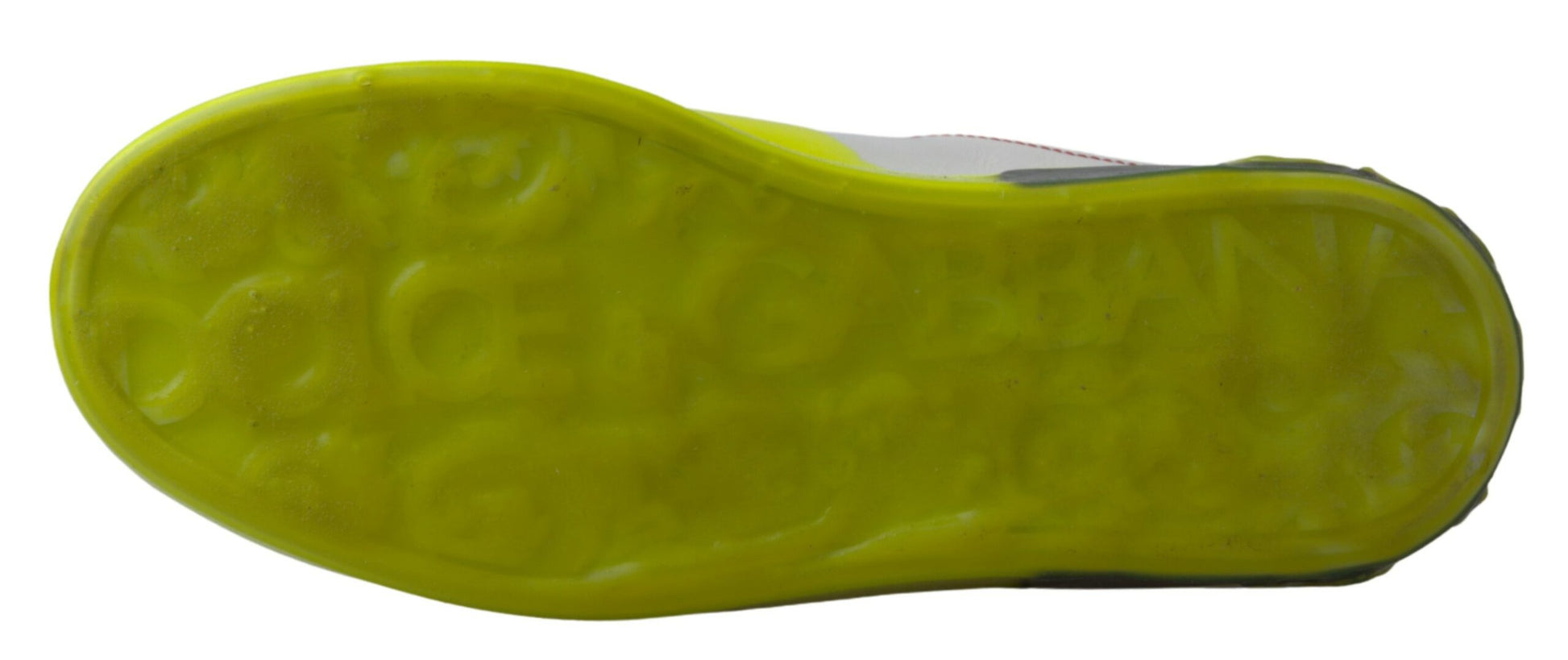 A pair of yellow and white leather sneakers with a textured sole