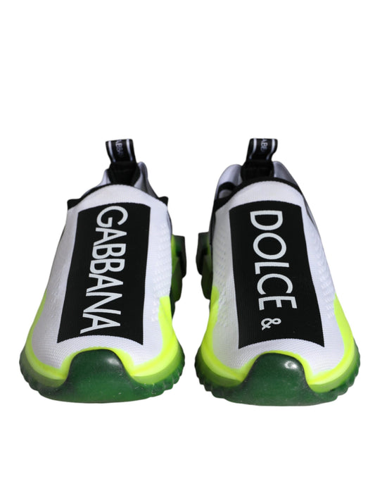Pair of white and yellow slip-on shoes with black text reading "Dolce & Gabbana" and "Sorrento"