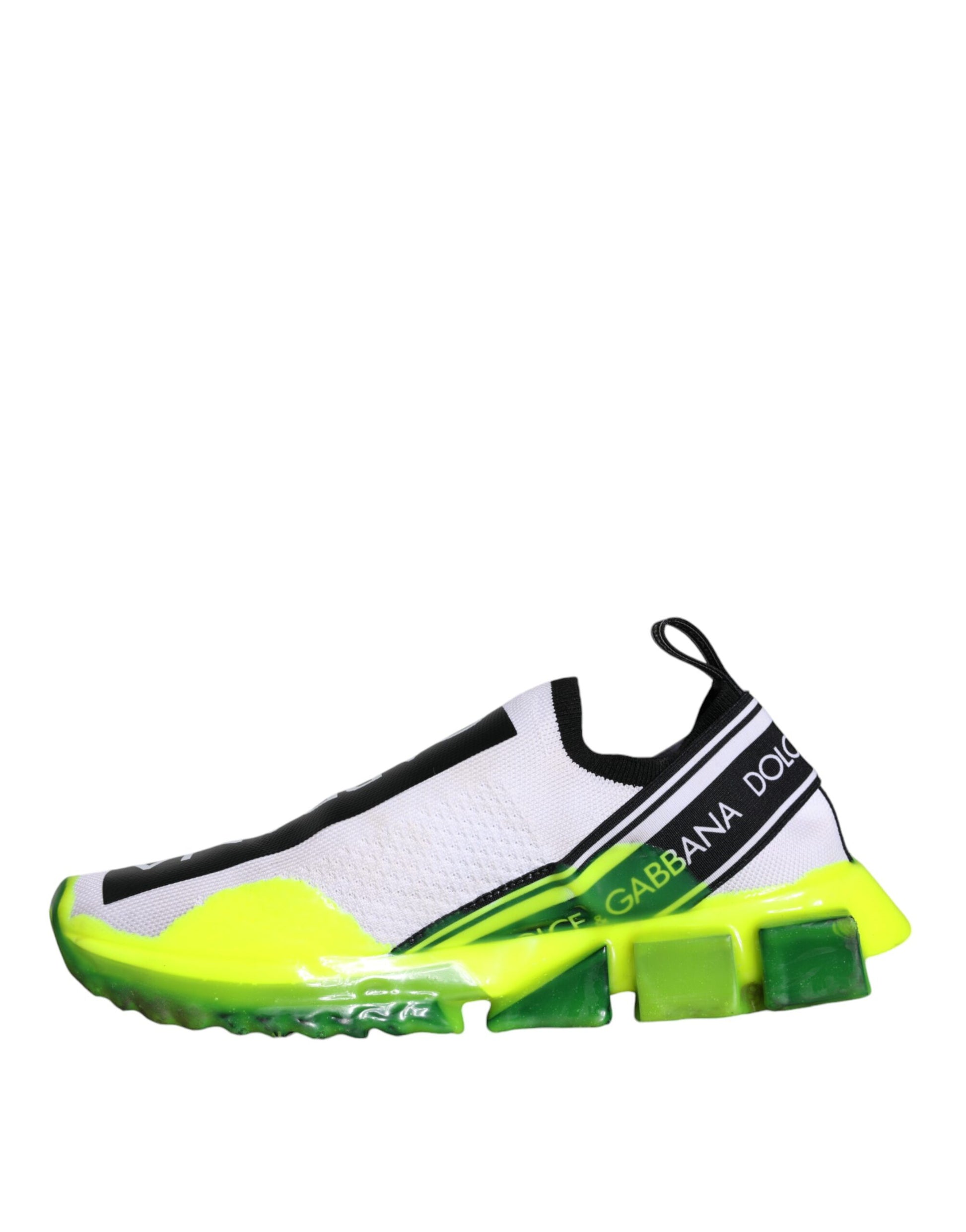 A pair of white and yellow slip-on shoes with the brand name "Dolce & Gabbana" visible on them
