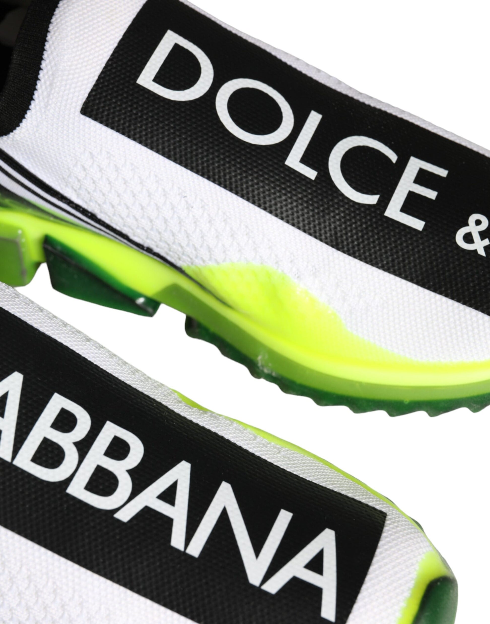 White and yellow slip on shoes with Dolce & Gabbana logo